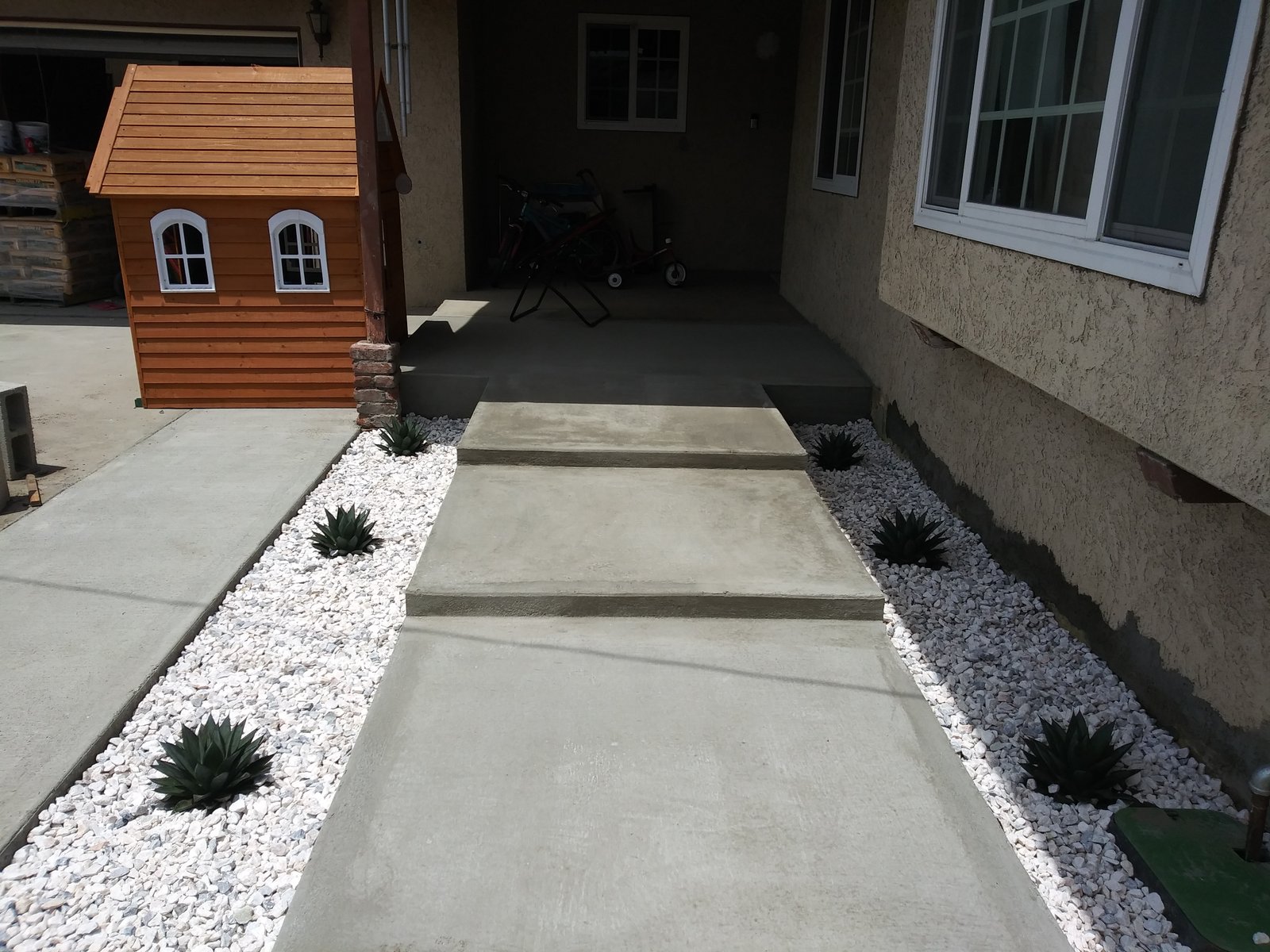 Concrete Front Steps with White Gravel Planters and Agave Installation
